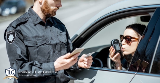 woman using a breeathalyzer